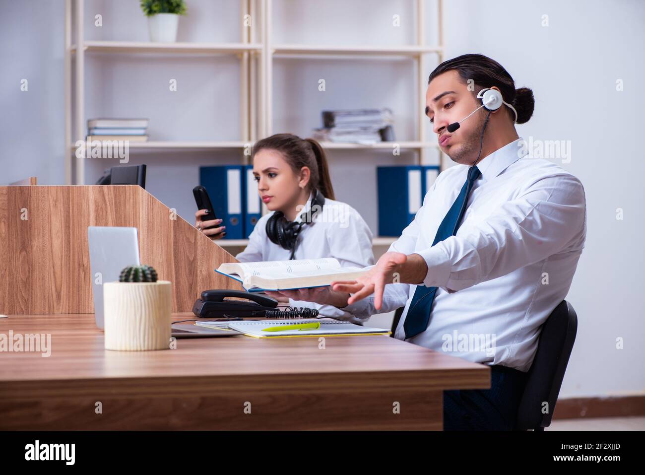 The call center operators working in the office Stock Photo - Alamy