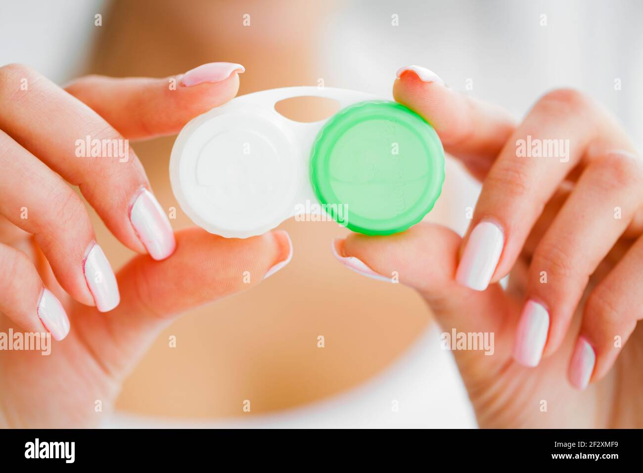 Vision And Medicine Concept. Young Girl Holds Eye Drops In Hands