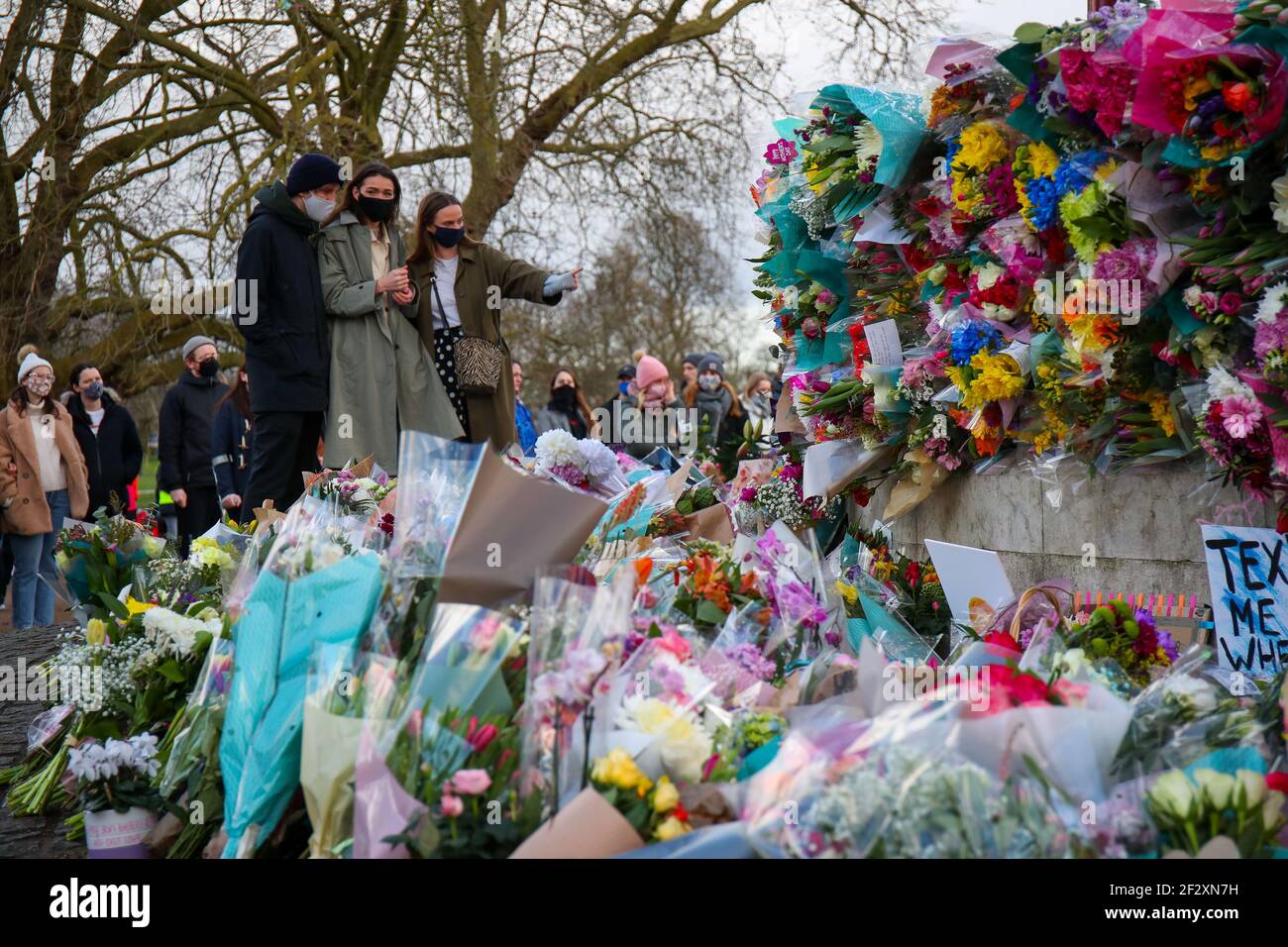 LONDON, ENGLAND - MARCH 13: Peoplelay flowers to pay their respects following the murder of Sarah Everard after an official vigil was cancelled due to the Covid-19 pandemic. Metropolitian Police Officer Wayne Couzens has been charged with her kidnap and murder. on Saturday 13th March 2021. (Credit: Lucy North | MI News) Credit: MI News & Sport /Alamy Live News Stock Photo