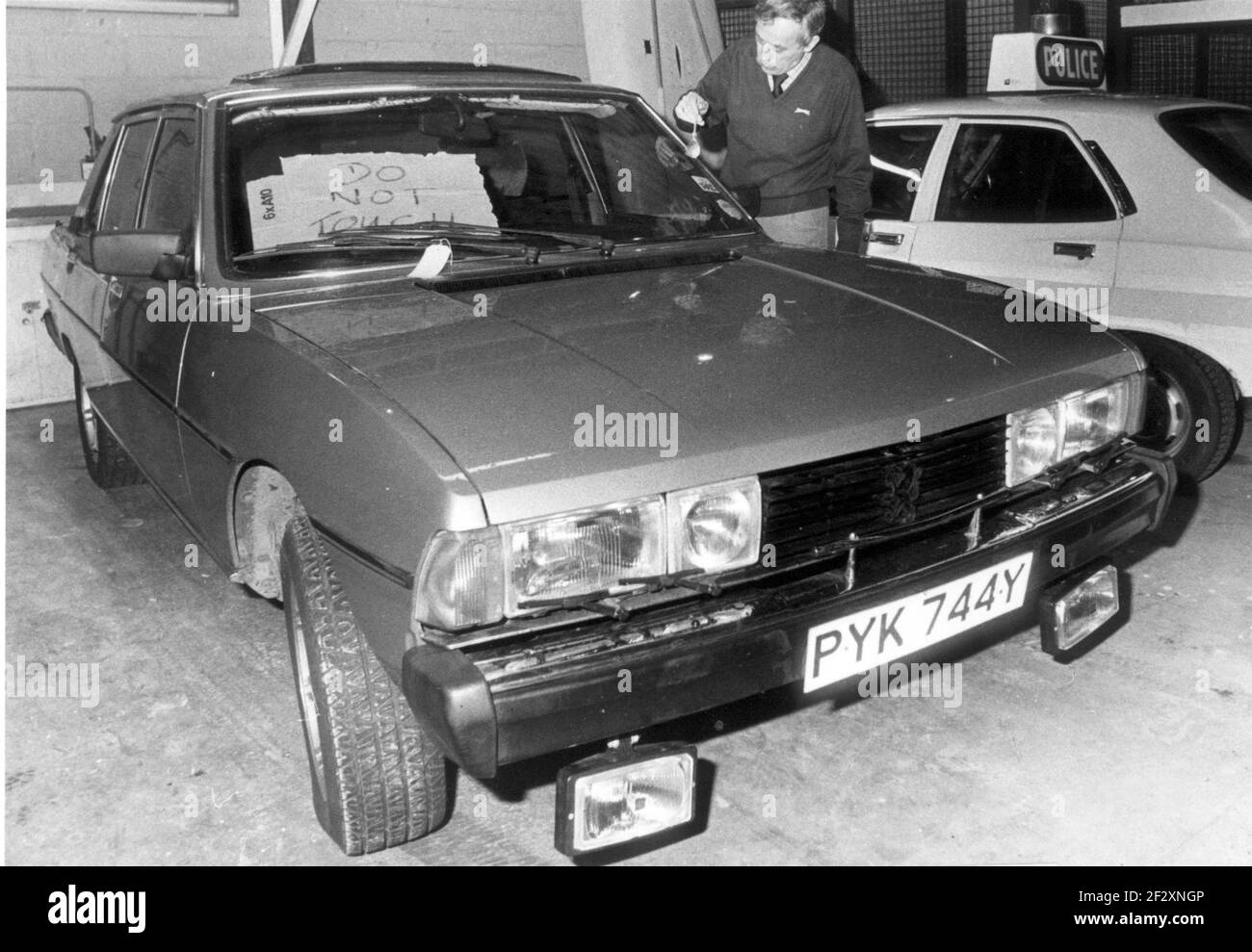 THE PEUGEOT CAR STOPPED BY PC'S TIMOTHY PHILLIPS AND BOB ELLIOTT WHICH  STARTED THE CAR CHASE THROUGH WEST SUSSEX AND HAMPSHIRE, BEING EXAMINED AT  LITTLEHAMPTON POLICE STATION BY FORENSIC EXPERTS. PIC MIKE