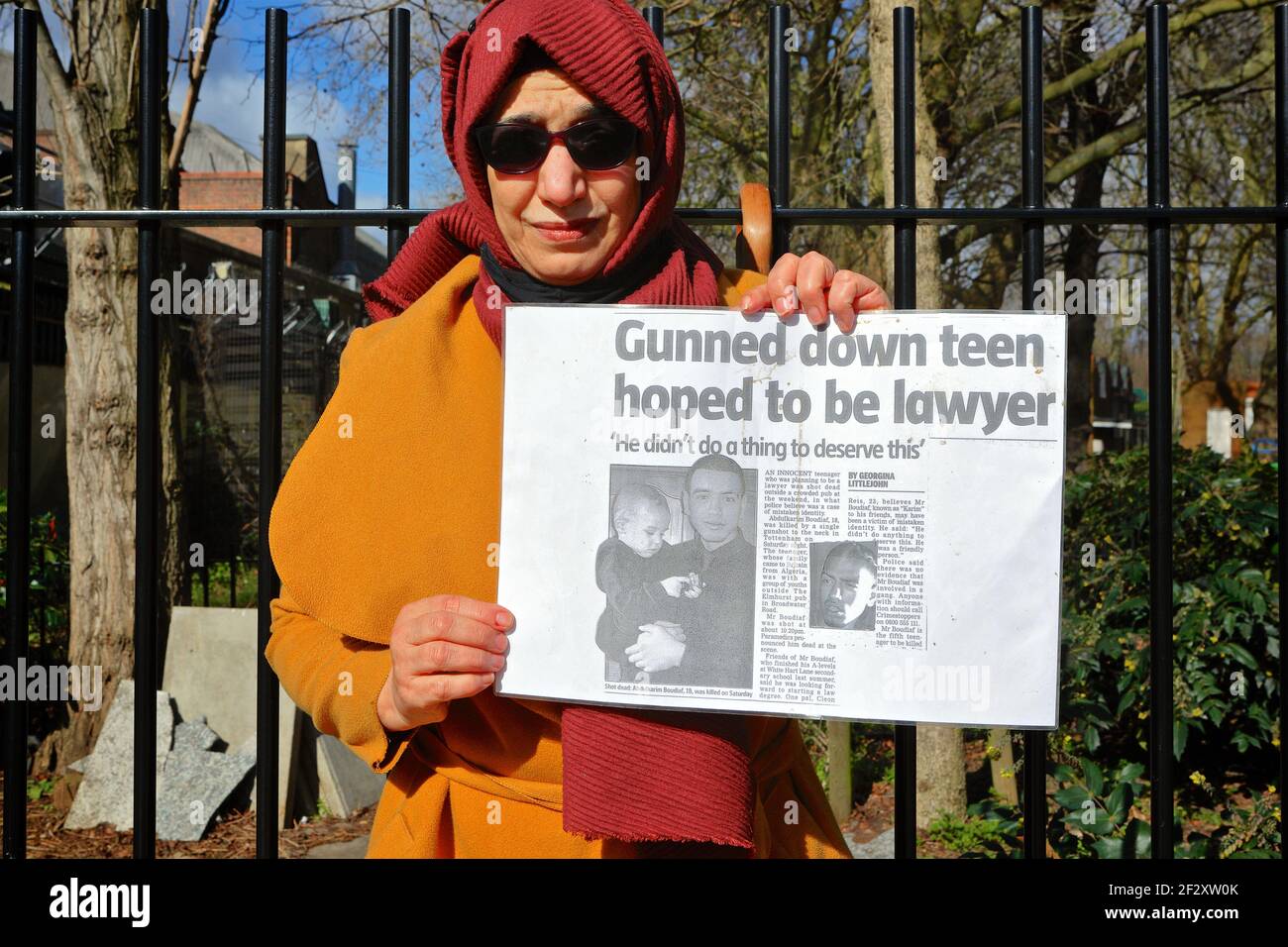 London (UK), March 13 2021: Hiva Boudiaf, mother of murder victim Karim Boudiaf holds up a newspaper article on the day preceding the 2021 Mothers Day Stock Photo