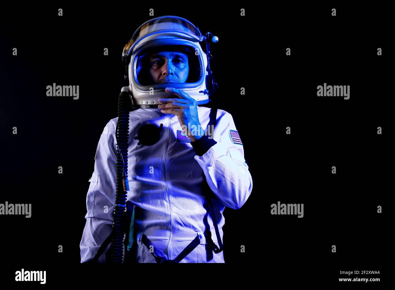 astronaut, standing spaceman isolated on black background Stock Photo -  Alamy