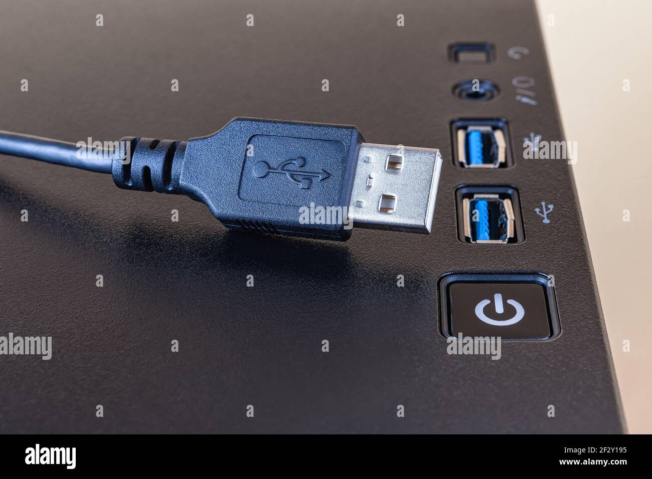 USB cable near two ports on the top of a modern computer tower case.  Information transfer and storage device. Universal Serial Bus connectors  standard Stock Photo - Alamy