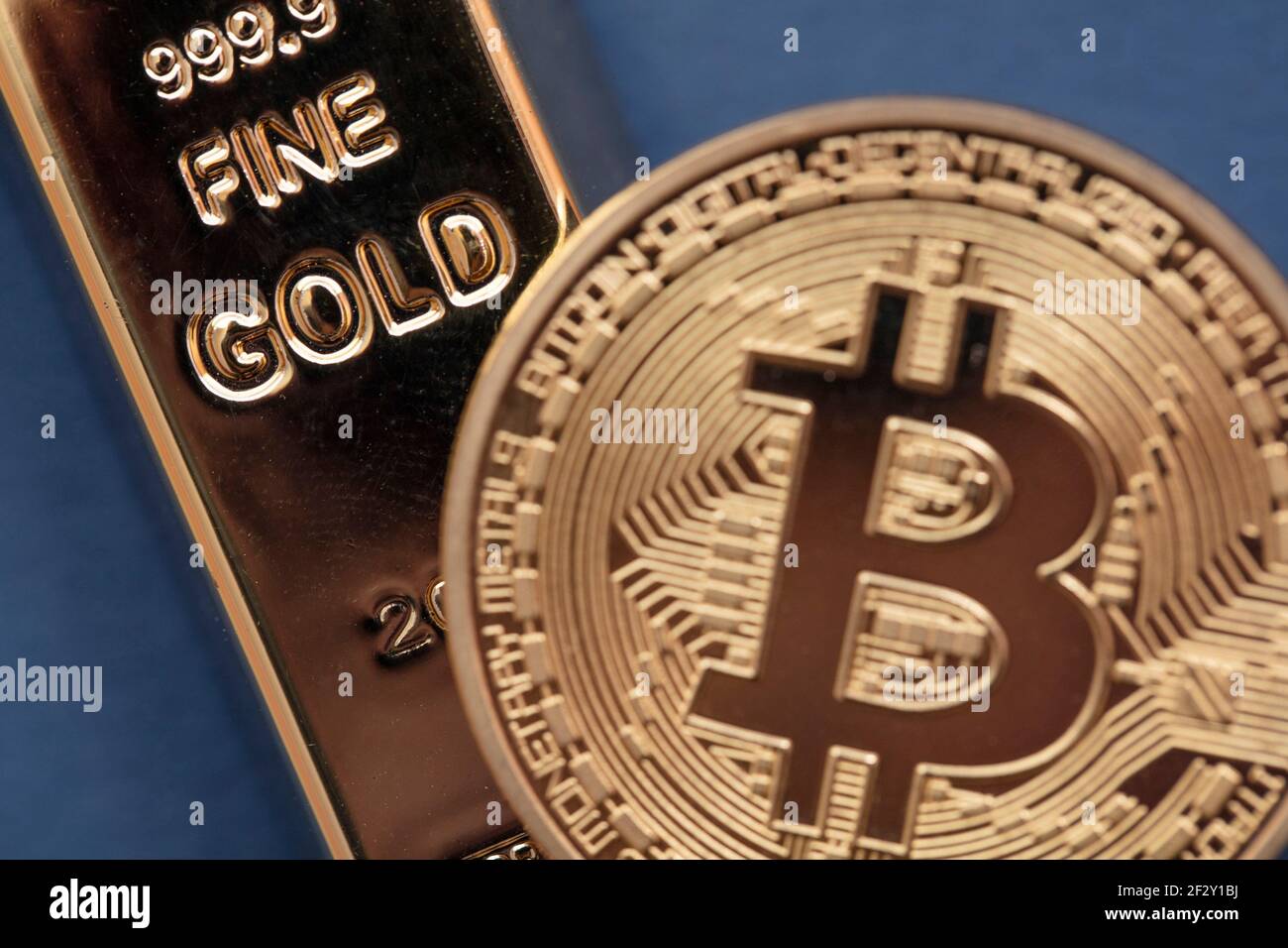 Bitcoin cryptocurrency coin with a gold bullion bar. Investment concept  Stock Photo - Alamy