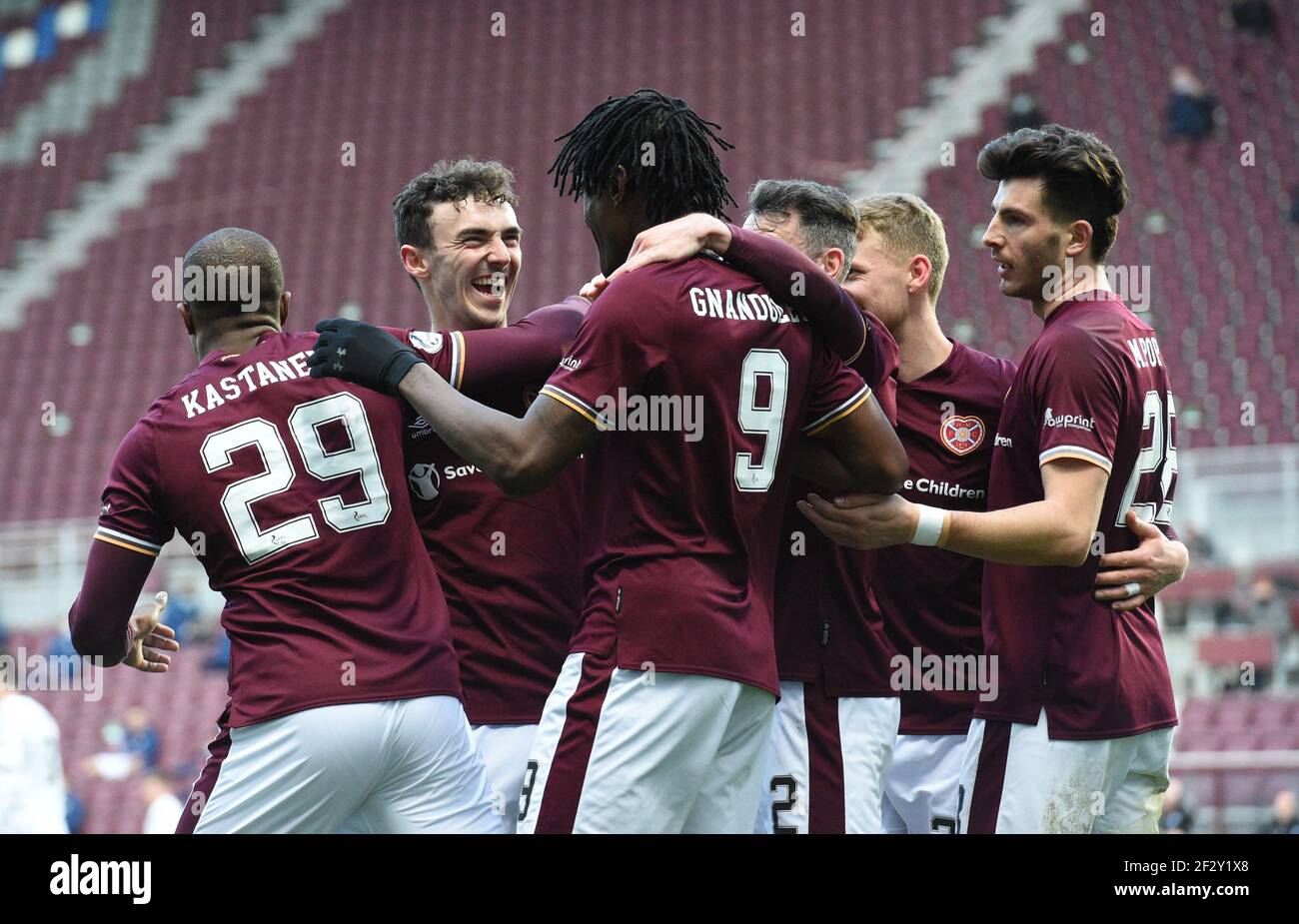 Tynecastle Park, Edinburgh, Scotland. UK .13th March 21. Scottish Championship Match .Hearts vs Ayr Utd Hearts' French striker, Armand Gnanduillet, (9) celebrates his goal with midfielder, Andy Irving, Credit: eric mccowat/Alamy Live News Stock Photo