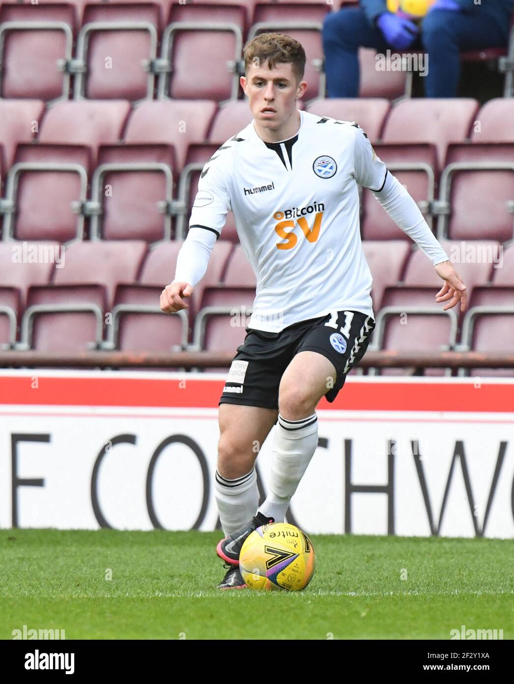 Tynecastle Park, Edinburgh, Scotland. UK .13th March 21. Scottish Championship Match .Hearts vs Ayr Utd Luke Mc Cowan Ayr Utd Credit: eric mccowat/Alamy Live News Stock Photo