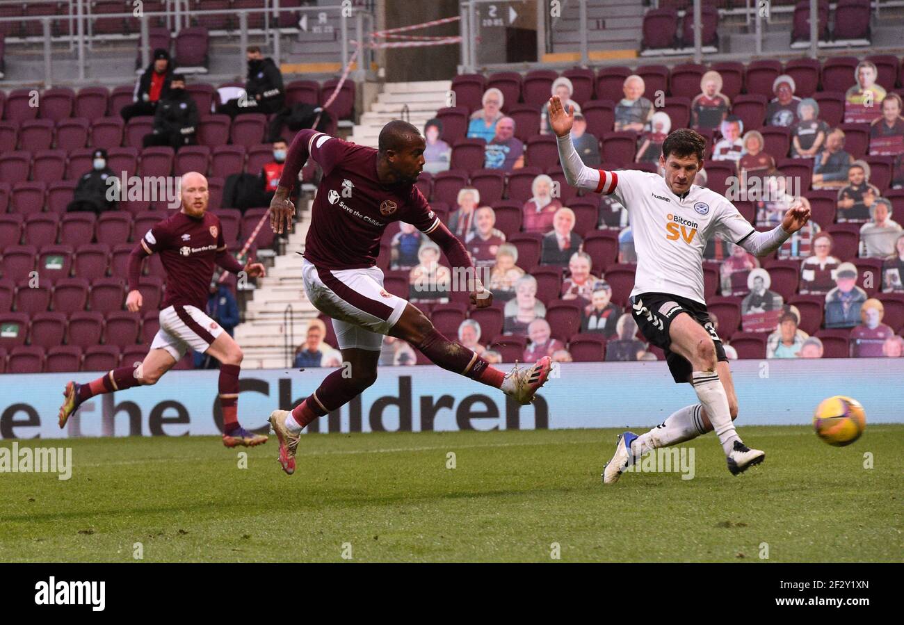 Tynecastle Park, Edinburgh, Scotland. UK .13th March 21. Scottish Championship Match .Hearts vs Ayr Utd Hearts' Gervane Kastaneer, shoots for goal Credit: eric mccowat/Alamy Live News Stock Photo