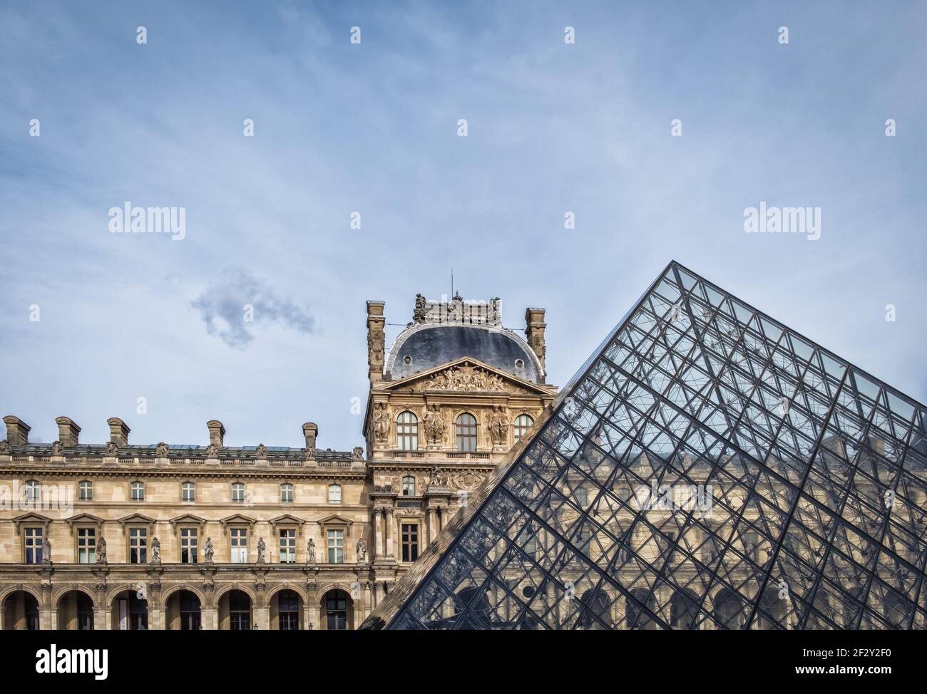Paris, France, Feb 2020, top of the Pyramid facing the Pavillon Richelieu one of the Pavillon in the Louvre Museum in main courtyard Cour Napoleon Stock Photo