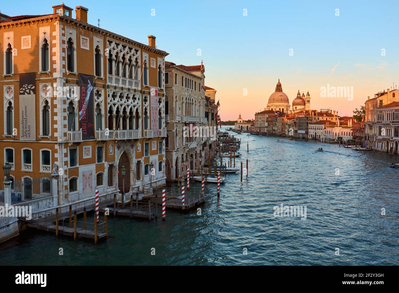 MAY 21, 2017 - VENICE, ITALY: View of the Grand Canal and Santa Maria della Salute, famous Roman Catholic cathedral, seen from Ponte Dell'Accademia. Stock Photo