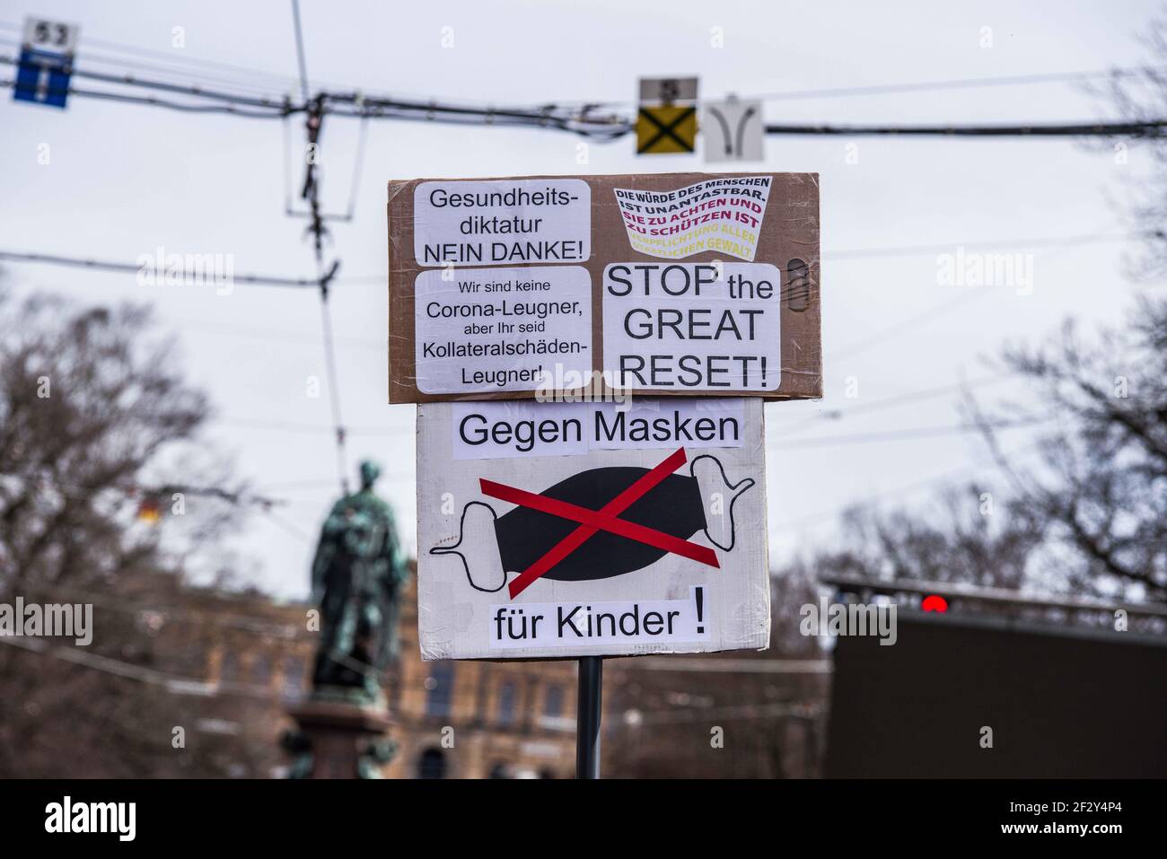 Munich, Bavaria, Germany. 13th Mar, 2021. A sign which includes the conspiracy of The Great Reset as seen at an anti-mask demo against the anti-Corona measures. Using the occasion of Germany going into a period of anti-Corona measures approximately one year ago, Corona deniers and anti-maskers led by Querdenken's Markus Haintz assembled at Munich's Marienplatz and then at the Maxmonument in an effort to protest against the Bavarian Landtag and promote their initiative to dissolve it and install a provisional government, presumably made of right-extremists, conspiracy theorists, QAnons, L Stock Photo