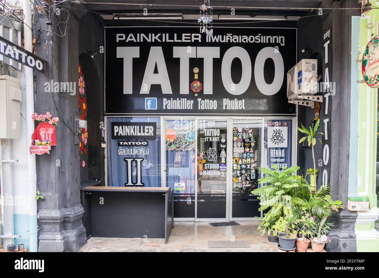 Painkiller tattoo shop in Old Phuket Town, Thailand Stock Photo - Alamy