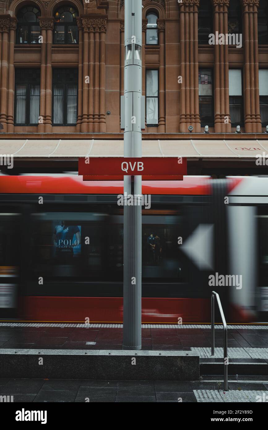 Station sign at Queen Victoria Building Light Rail stop on a rainy day