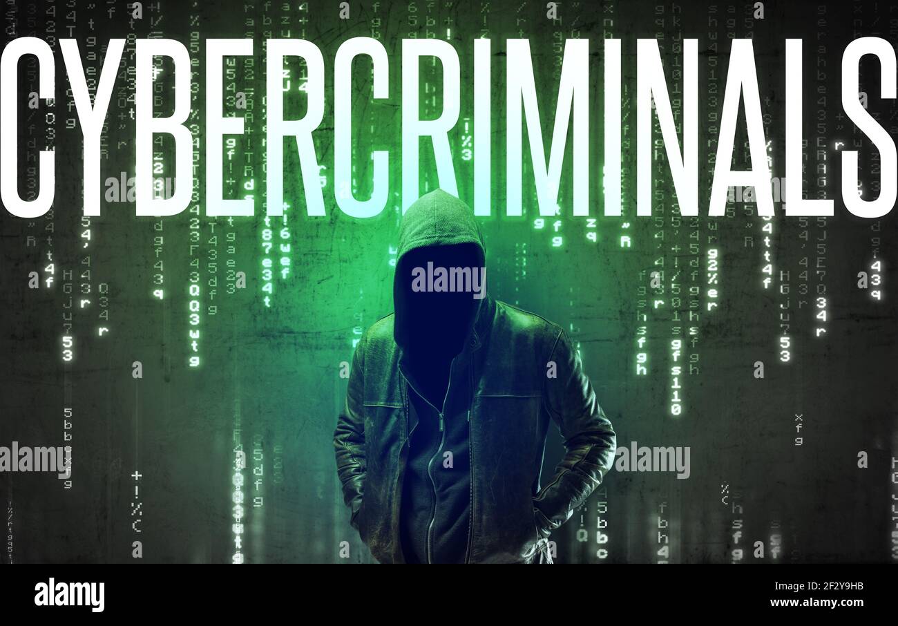 Faceless hacker with inscription Stock Photo