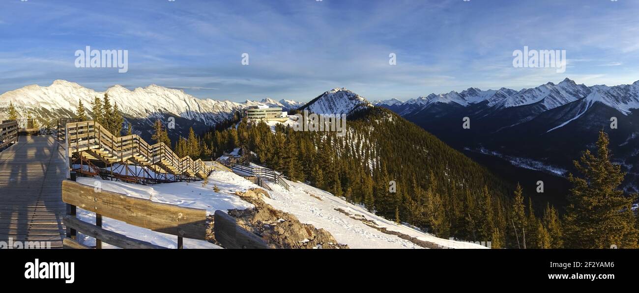 Sulphur Mountain Boardwalk and Gondola Station Upper Terminal above City of Banff, Alberta. Scenic Panoramic Winter Landscape high in Canadian Rockies Stock Photo