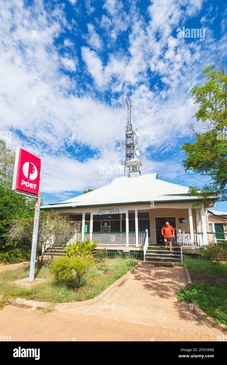 Person walking out of the Cunnamulla Post Office located in an old quaint Queenslander house, Cunnamulla, Queensland, QLD, Australia Stock Photo