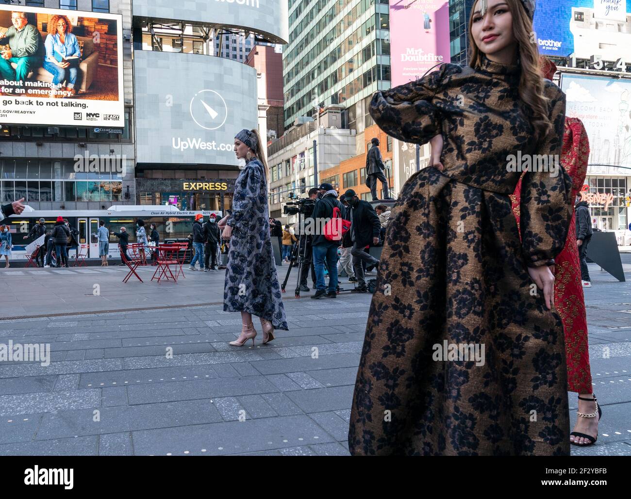 New York, NY - March 13, 2021: Models show off dresses by designer Veronica  Adamo on Times Square while protest for Breonna Taylor unfolds on  background Stock Photo - Alamy