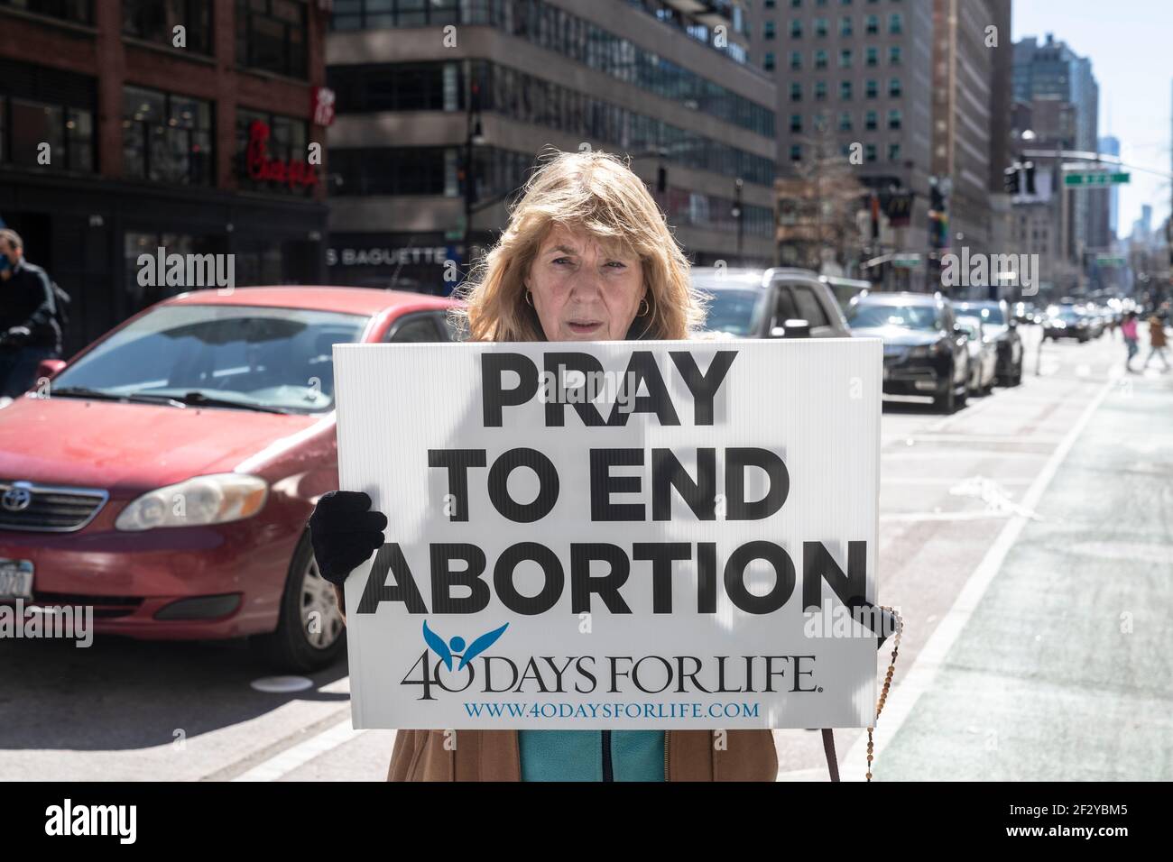 New York, NY - March 13, 2021: Clergy and members of Roman Catholic Church The Holy Innocents march and pray to end abortion on Midtown streets Stock Photo