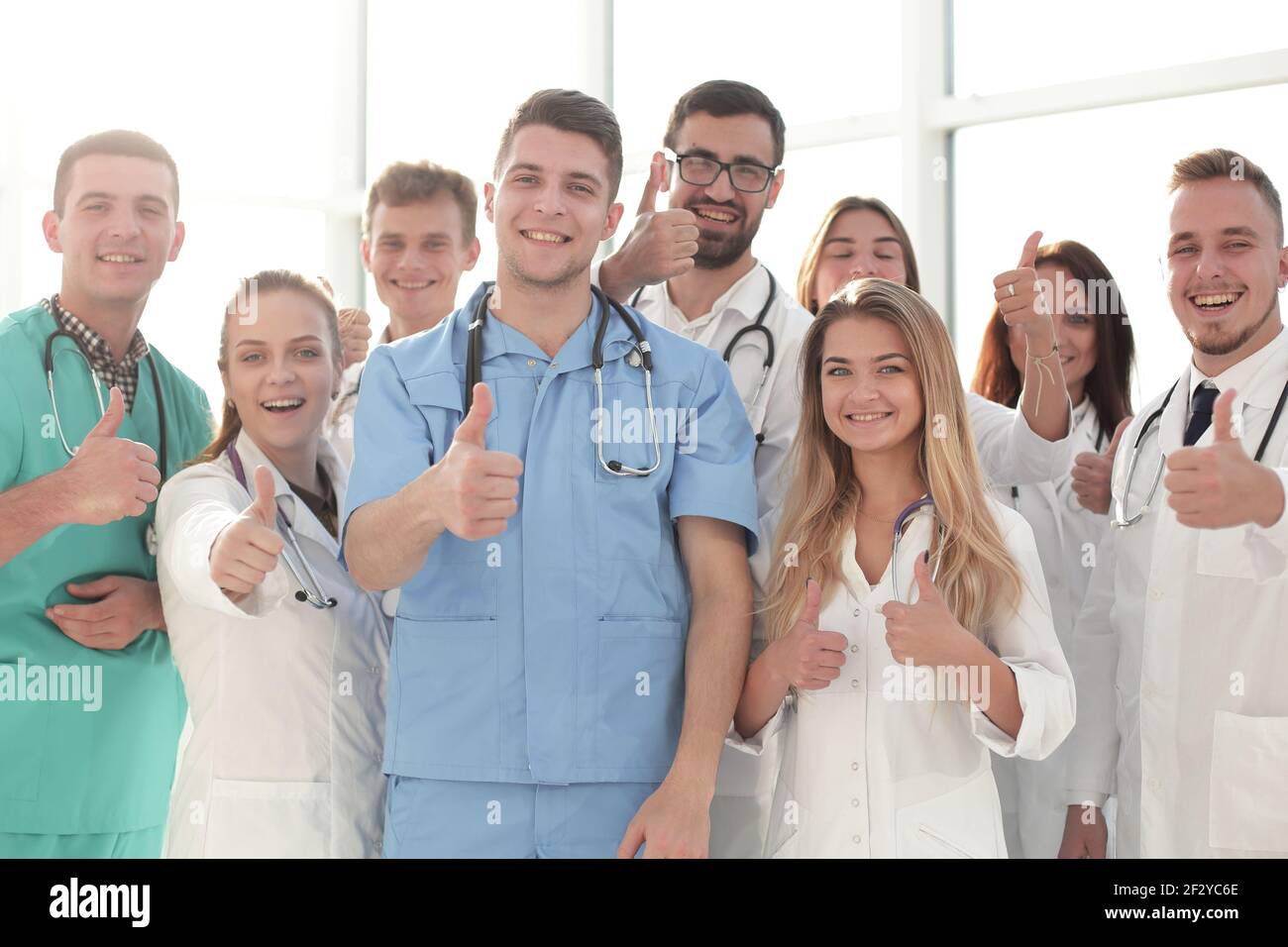 close up. young medical professionals showing thumbs up Stock Photo - Alamy