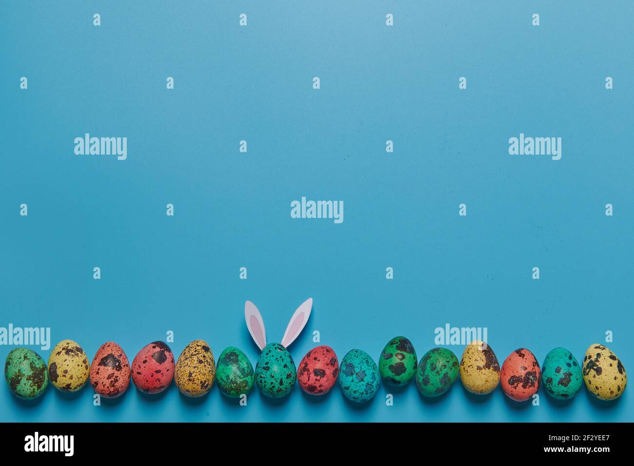 painted eggs on a blue background for easter Stock Photo