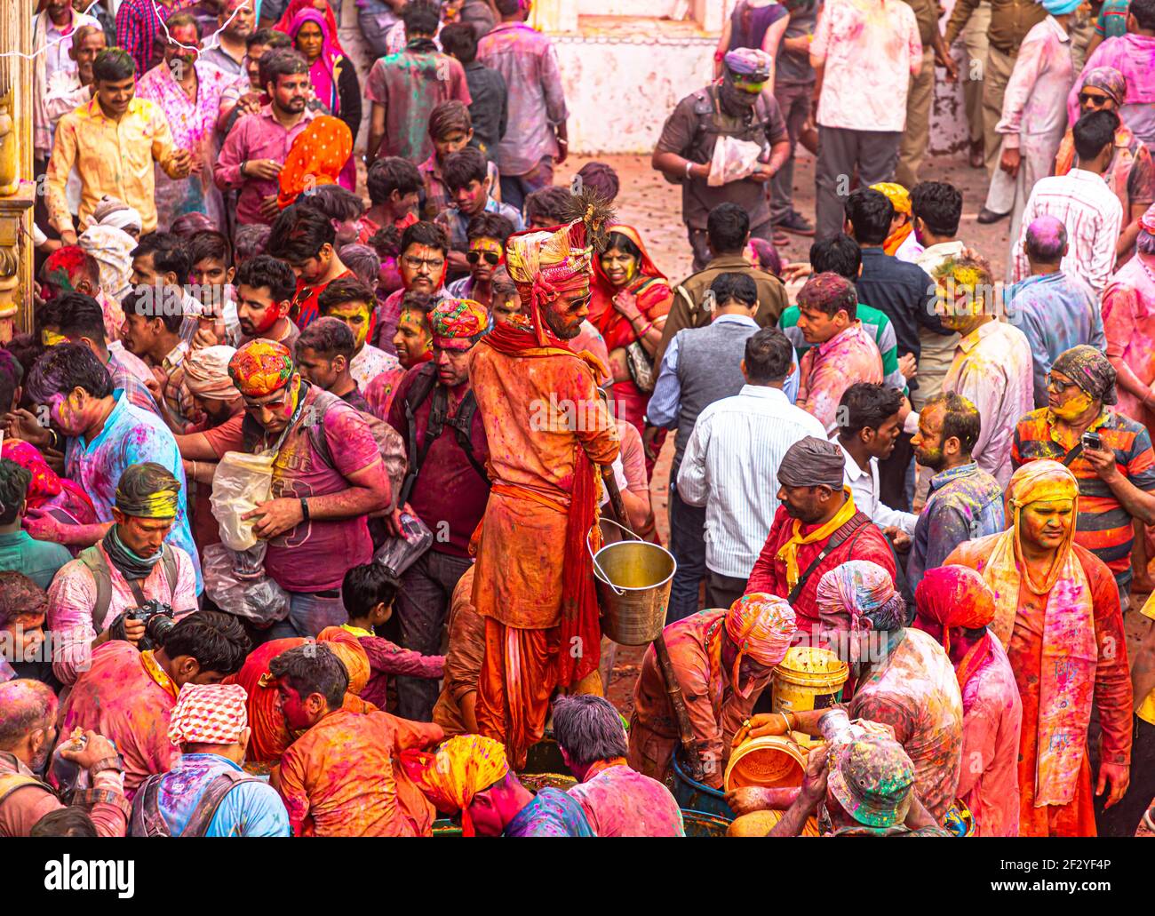 people celebrating and playing holi at nandgaon,mathura, with selective focus on subject with added noise and grains. Stock Photo