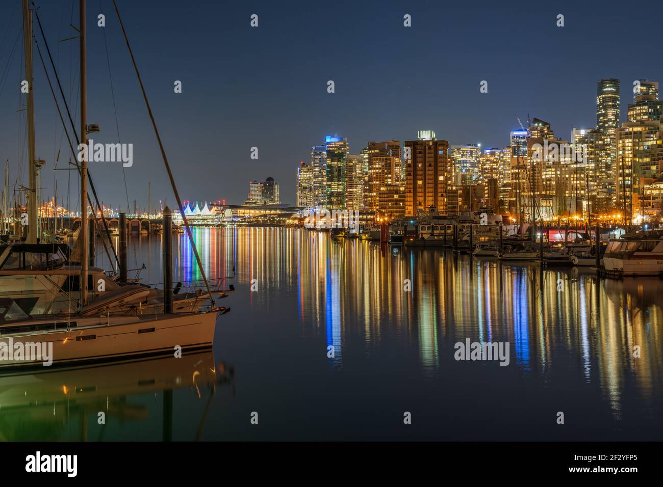 Night view of Vancouver Harbour marina skyline. Downtown buildings ...