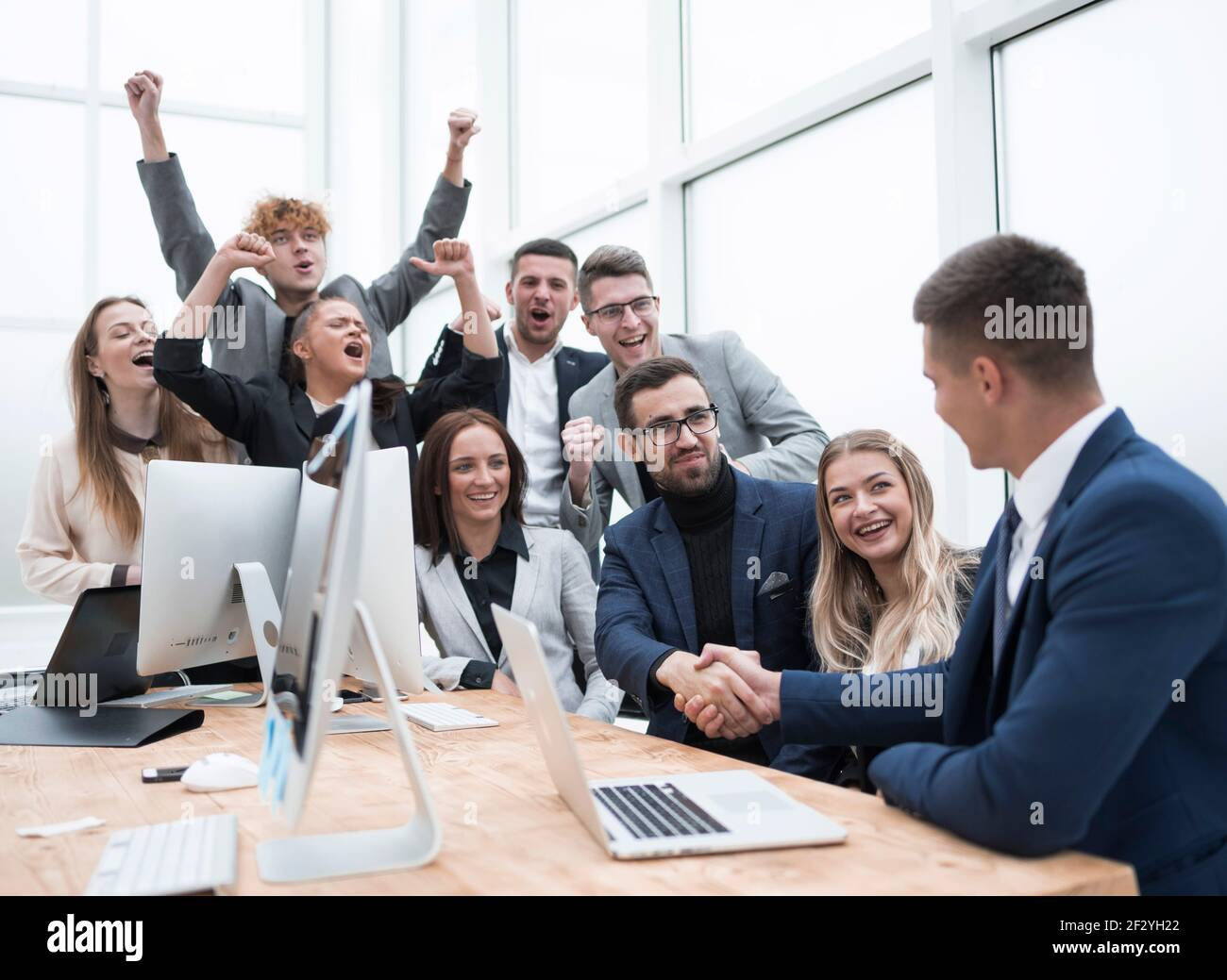 cheering business team applauding new business partners Stock Photo - Alamy