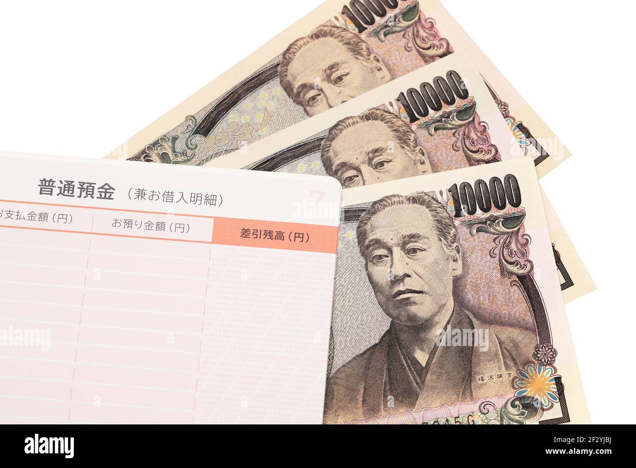 Ten thousand Japanese yen with passbook isolated on white background. Stock Photo