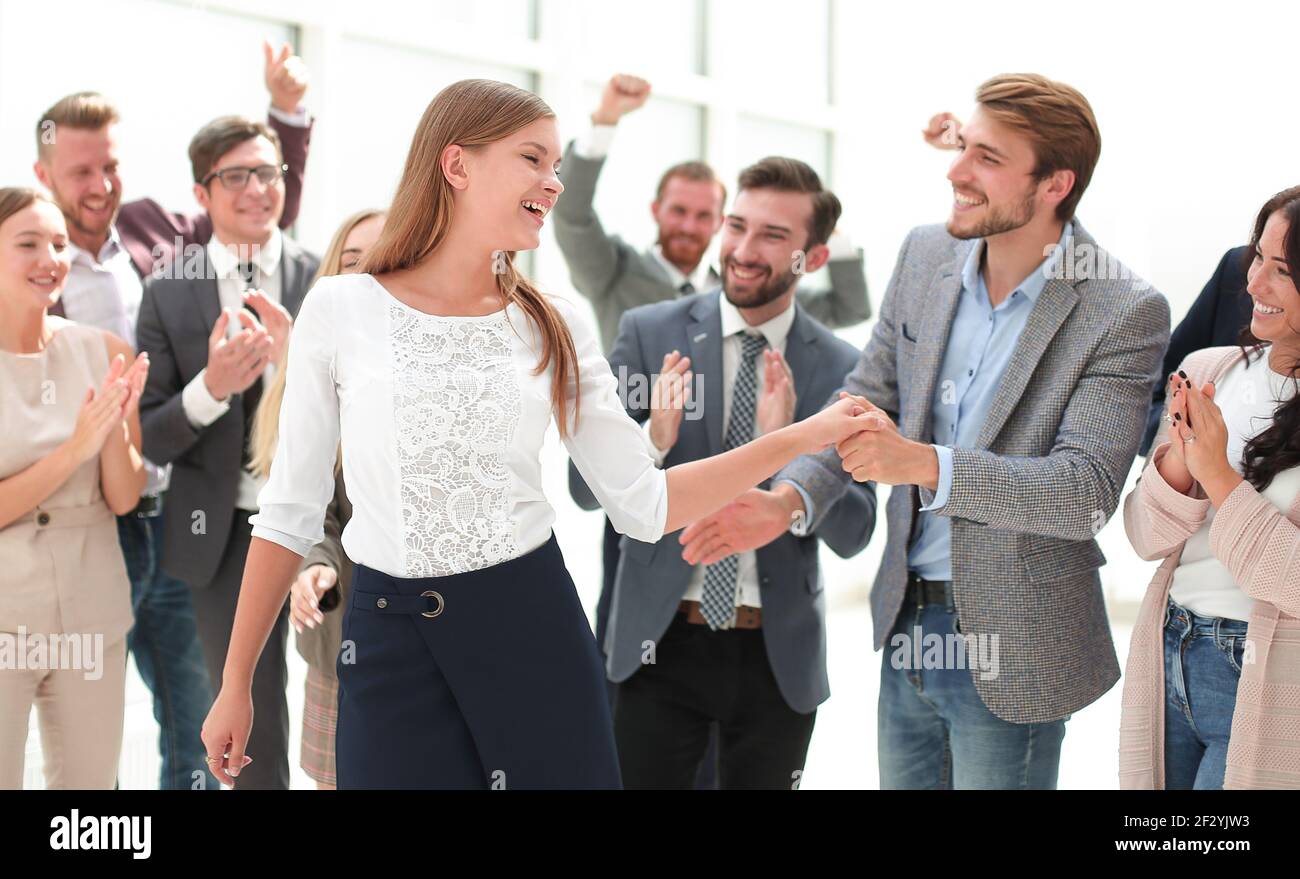 young business woman shaking hands with her colleague Stock Photo
