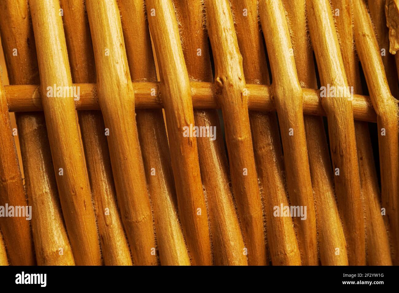 Dark orange twigs woven together close up Stock Photo