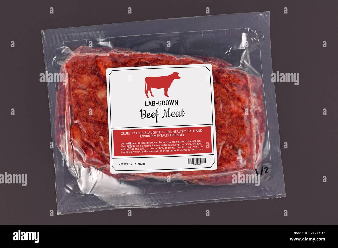 Lab grown cultured meat concept for artificial in vitro cell culture meat production with frozen packed raw meat with made up label on dark background Stock Photo