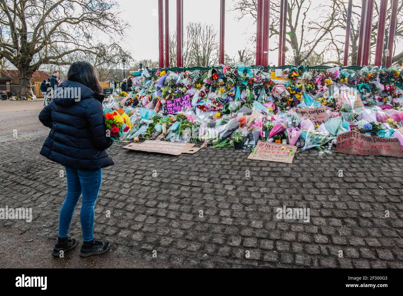 London UK 14 March 2021 ,After last night vigil ,that finished with arrests ,people continue to bring floats tribute to the bandstand in Clapham Common. Paul Quezada-Neiman, Alamy Live  News Stock Photo