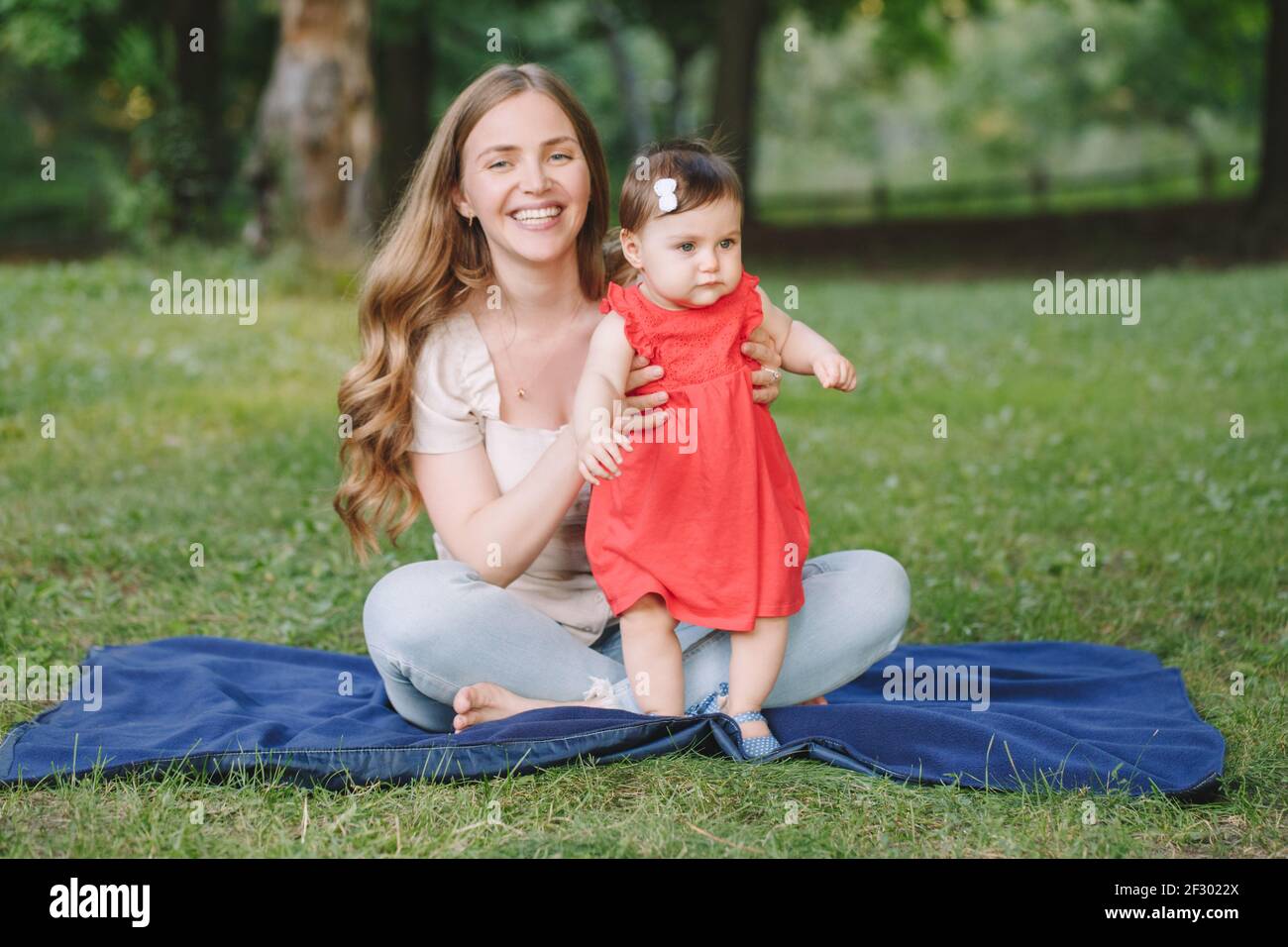 Mother Helping Baby Walk First High Resolution Stock Photography And Images Alamy