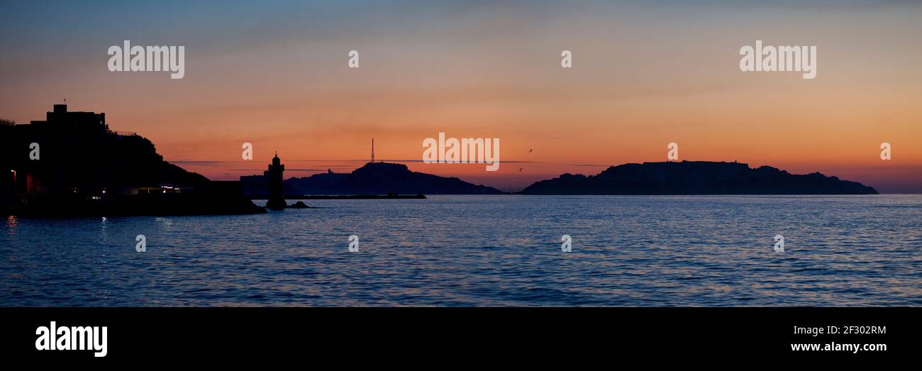 Panoramic view of the district of 'Le Pharo' in Marseille, at sunset, with its lighthouse and behind, a small archipelago called 'Les Îles' (The Islan Stock Photo