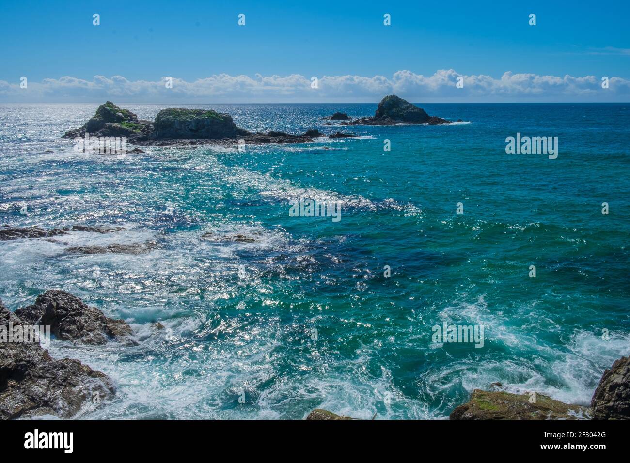 Waves breaking on rocks and cliffs Stock Photo