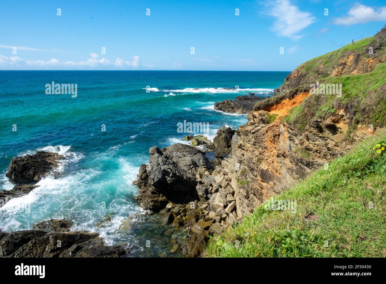 Waves breaking on rocks and cliffs Stock Photo