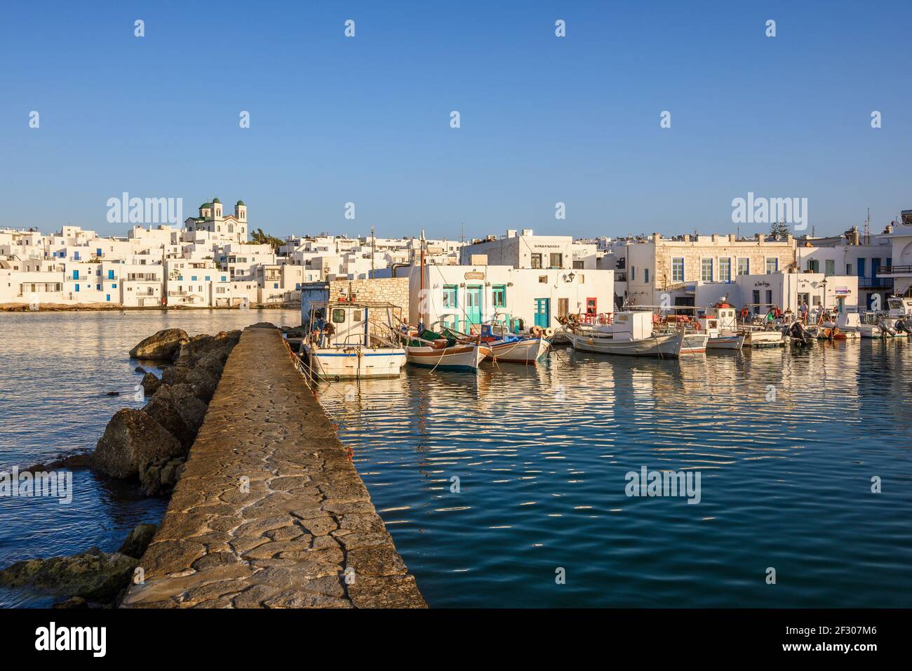 Naoussa harbor with traditional Greek houses in the Cycladic style ...