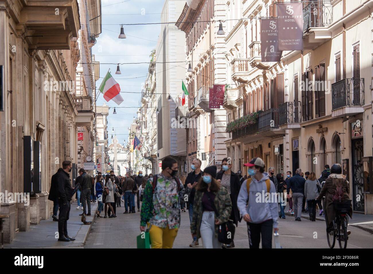 Rome, ITALY- 13 March 2021: People gather at the Via del Corso main shopping street in downtown Rome before the government tightens restrictions across most of the country from March 15, facing a 'new wave' of Covid-19 Stock Photo