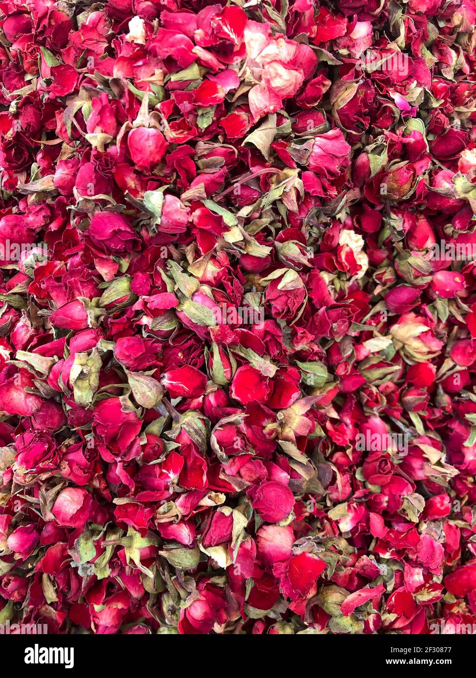 pile of dried red rose flowers for herbal tea Stock Photo - Alamy