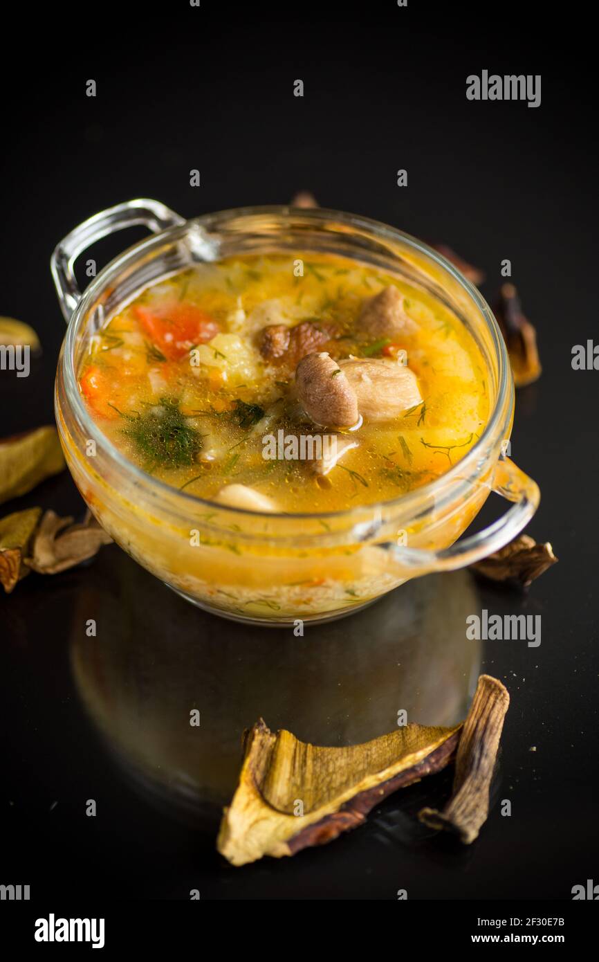 vegetarian vegetable soup with porcini mushrooms in a glass bowl