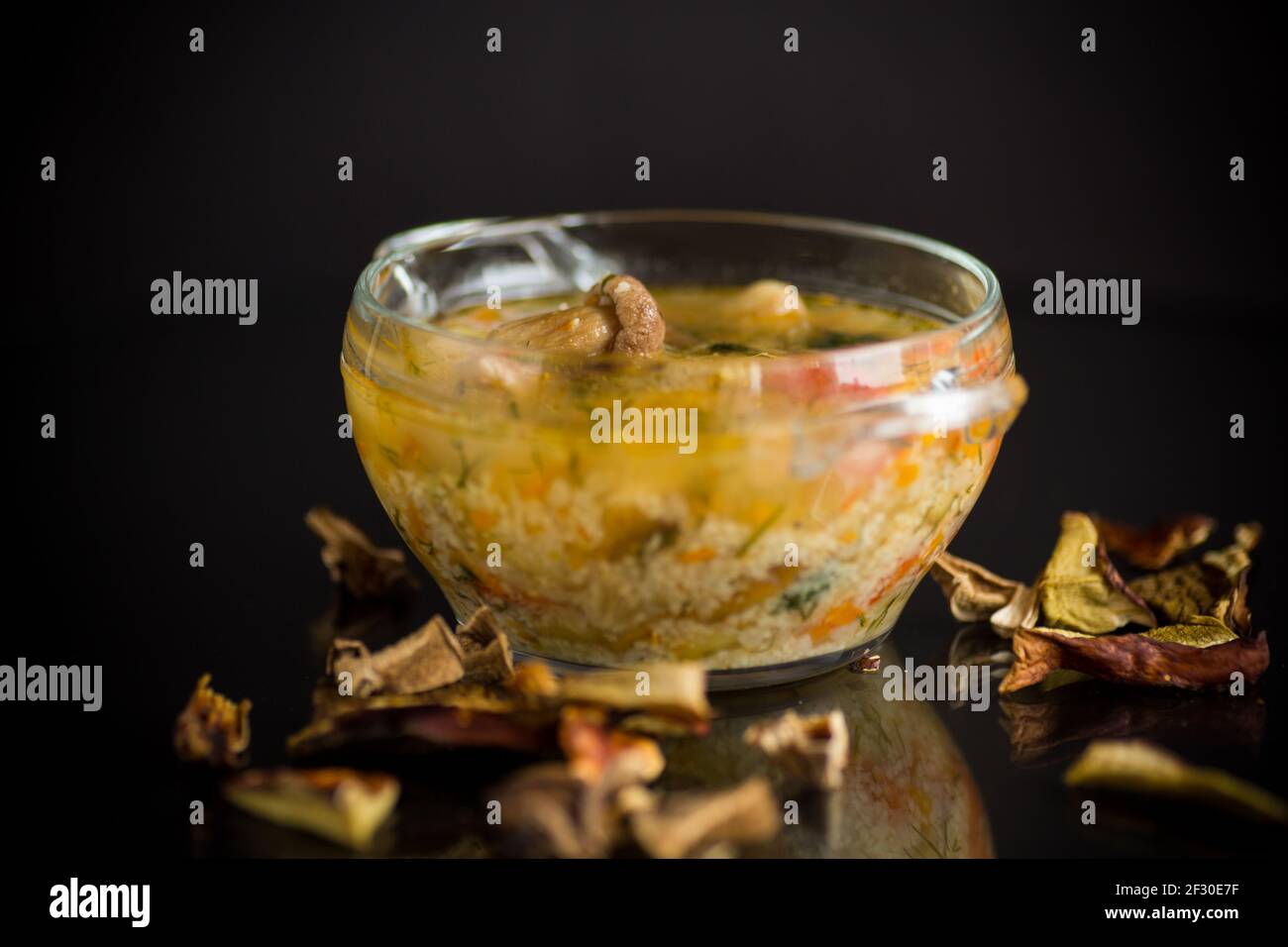 vegetarian vegetable soup with porcini mushrooms in a glass bowl
