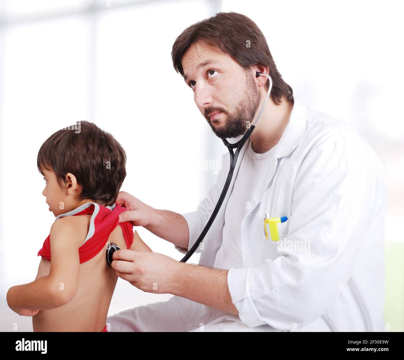 Врач осматривает мальчиков. Boy Doctor. Boy Doctor check up. Young Doctor. Doctor examines a little boy.
