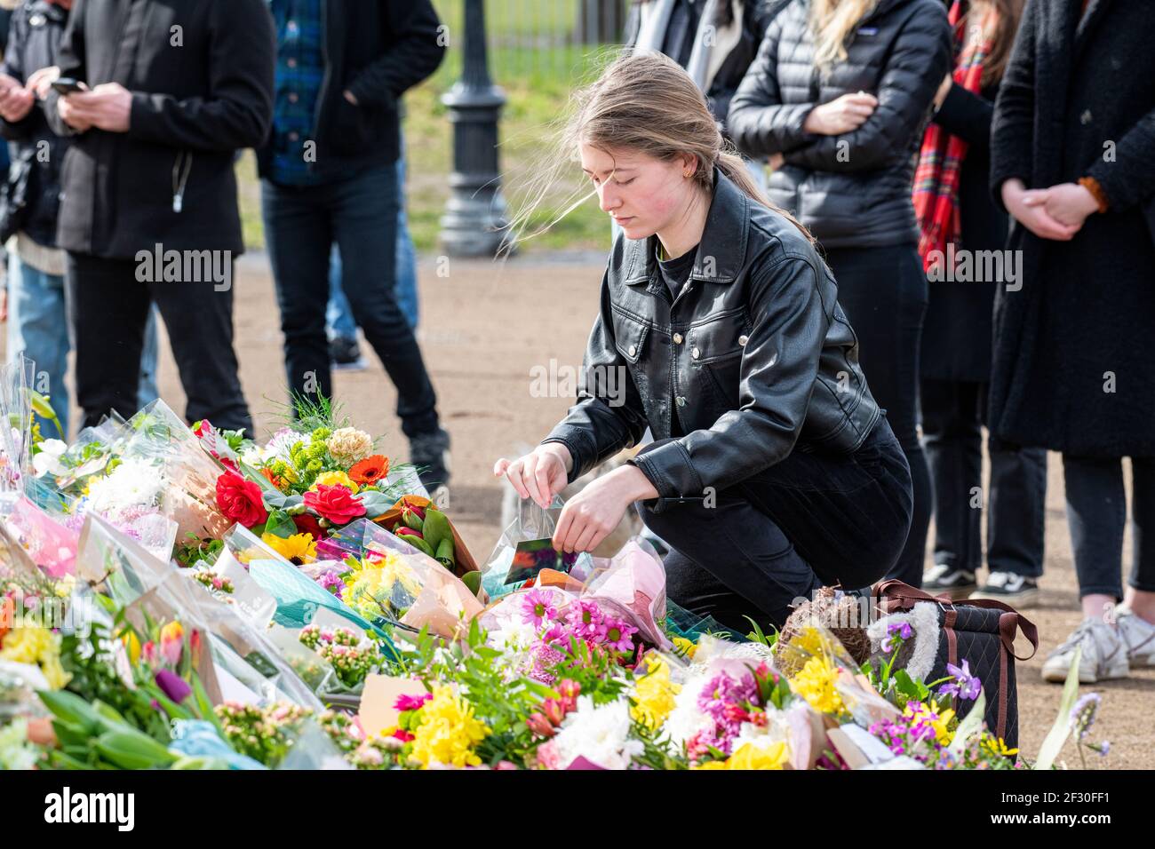 14th March 2021 - families pay their respects and lay floral tributes for Sarah Everard on Clapham Common, the day after the cancelled vigil Stock Photo