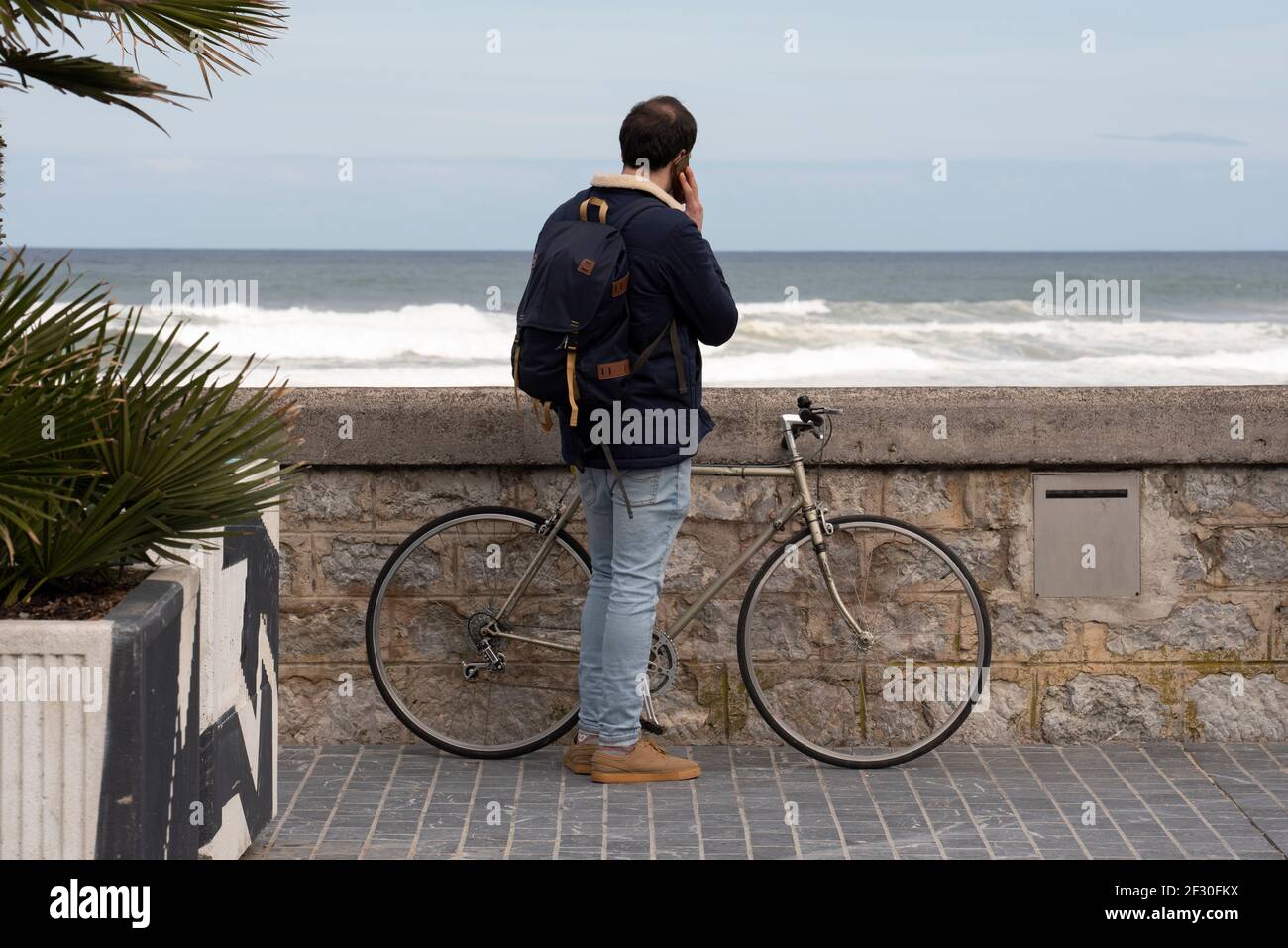 cyclist talking on the phone Stock Photo