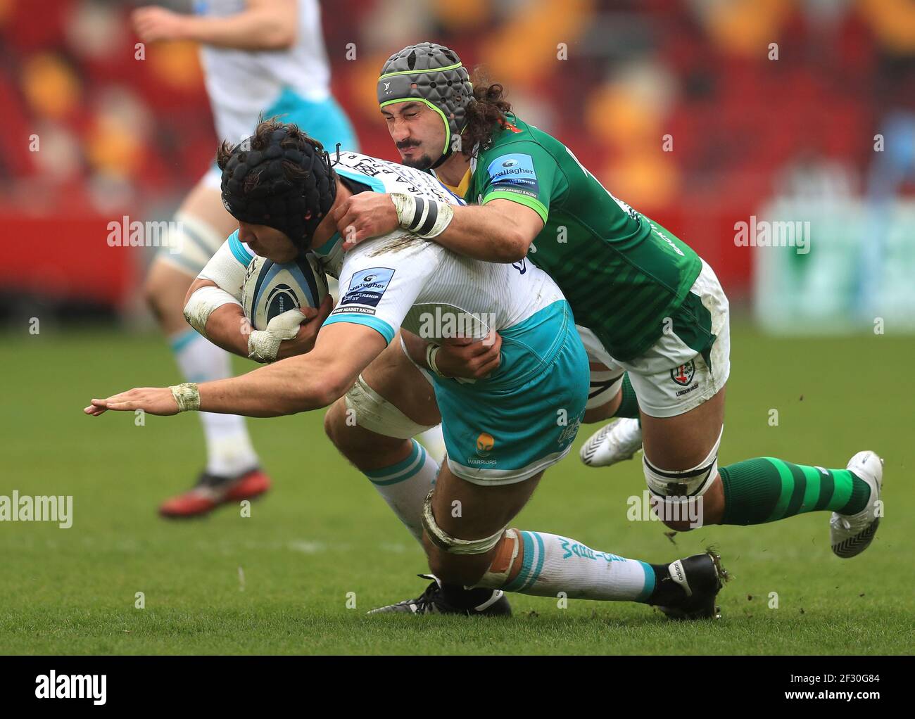 Worcester Warriors' Andrew Kitchener (left) is tackled by London Irish's Blair Cowan during the Gallagher Premiership match at the Brentford Community Stadium, London. Picture date: Sunday March 14, 2021. Stock Photo
