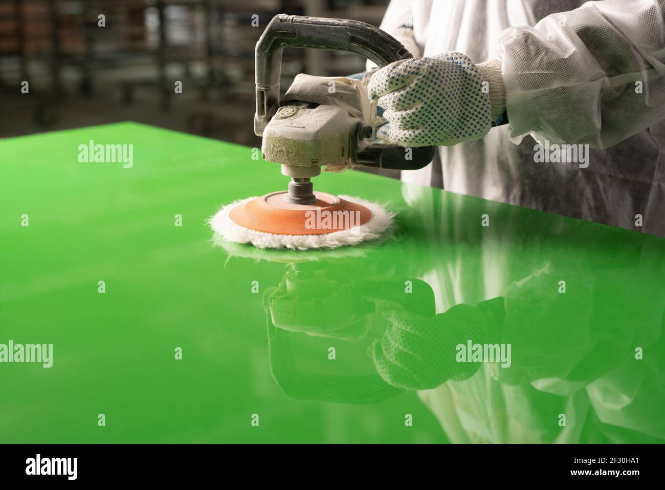Polishing green wood panel with grinder machine Stock Photo Alamy