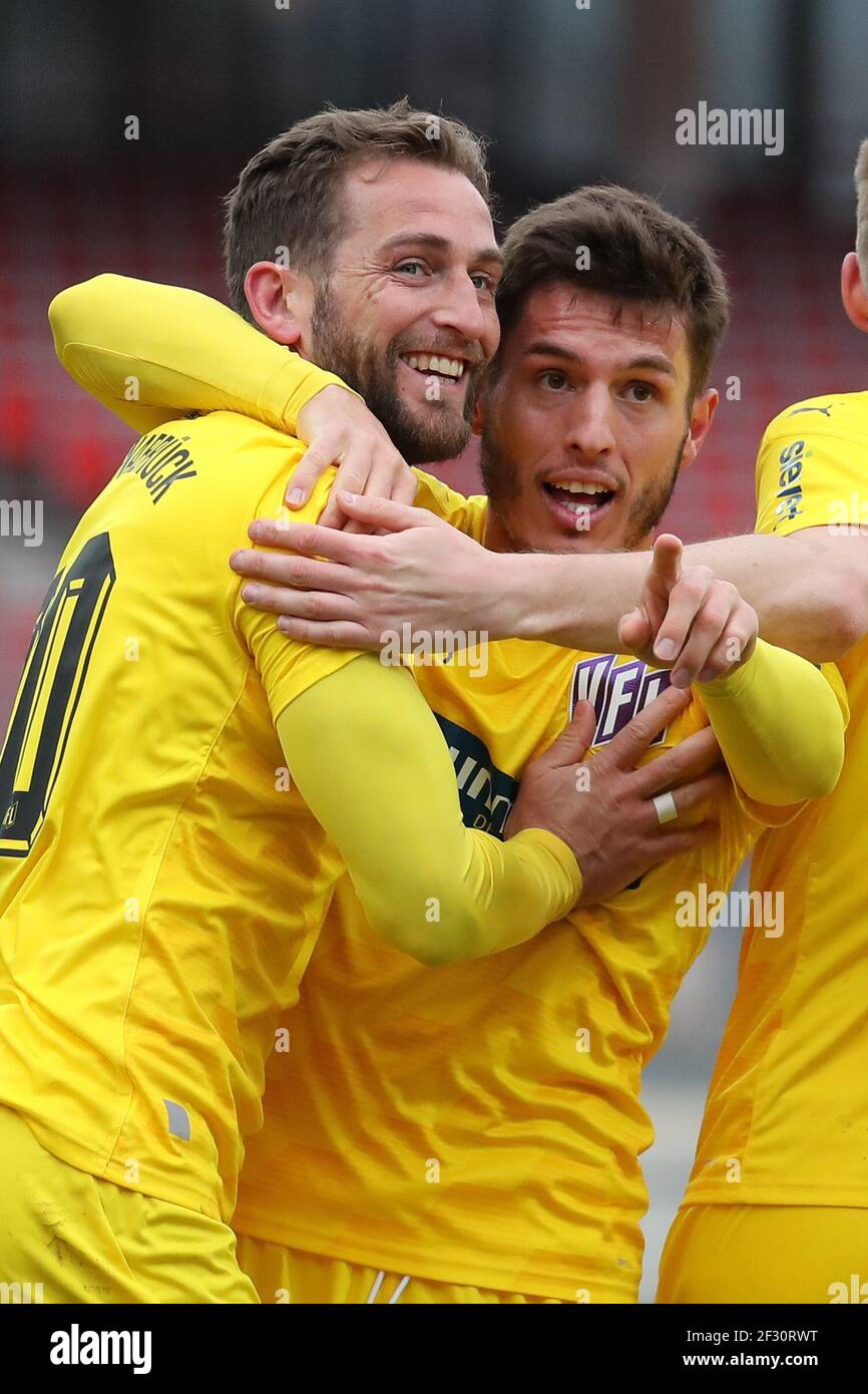 Nuremberg, Germany. 14th Mar, 2021. Football: 2. Bundesliga, 1. FC Nürnberg - VfL Osnabrück, Matchday 25 at Max-Morlock-Stadion. Marc Heider (l) of VfL Osnabrück celebrates with his colleague Bashkim Ajdini after scoring the goal to make it 1:1. Credit: Daniel Karmann/dpa - IMPORTANT NOTE: In accordance with the regulations of the DFL Deutsche Fußball Liga and/or the DFB Deutscher Fußball-Bund, it is prohibited to use or have used photographs taken in the stadium and/or of the match in the form of sequence pictures and/or video-like photo series./dpa/Alamy Live News Stock Photo