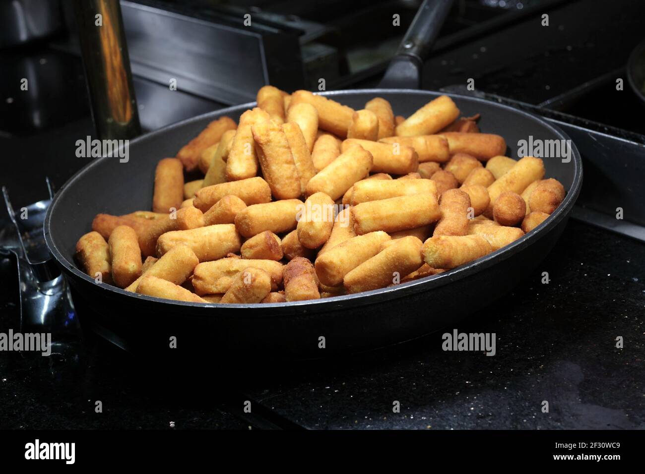 Fried cheese on a pan at buffet Stock Photo Alamy