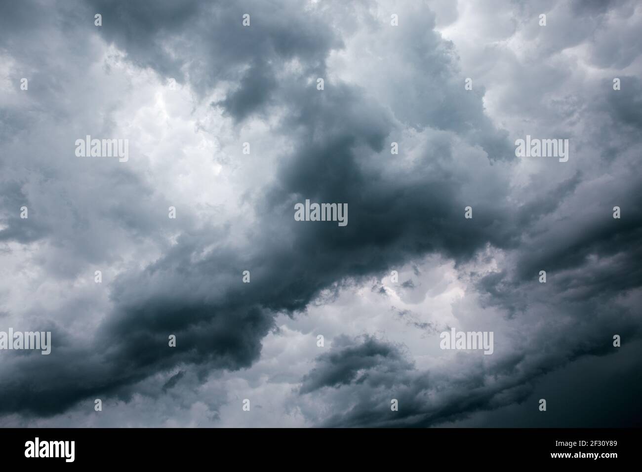 Dark ominous grey storm clouds. Dramatic sky. Stock Photo