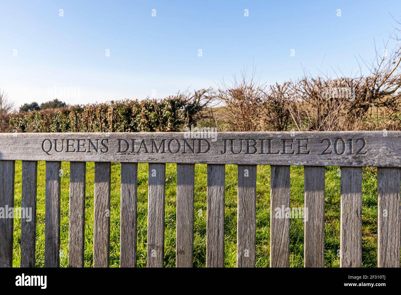Queen's Diamond Jubilee 2012 carved wooden bench in Canewdon, Essex, UK. Rural village Stock Photo