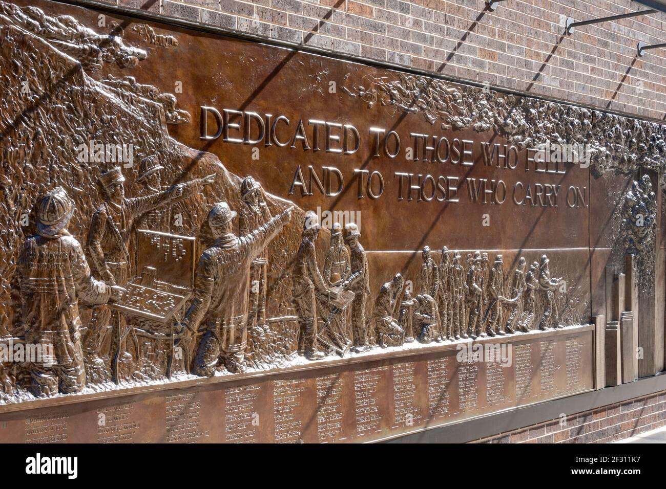 FDNY Memorial Wall in Lower Manhattan honors the firefighters who lost their lives on 9/11 at the World Trade Center, New York City, USA Stock Photo